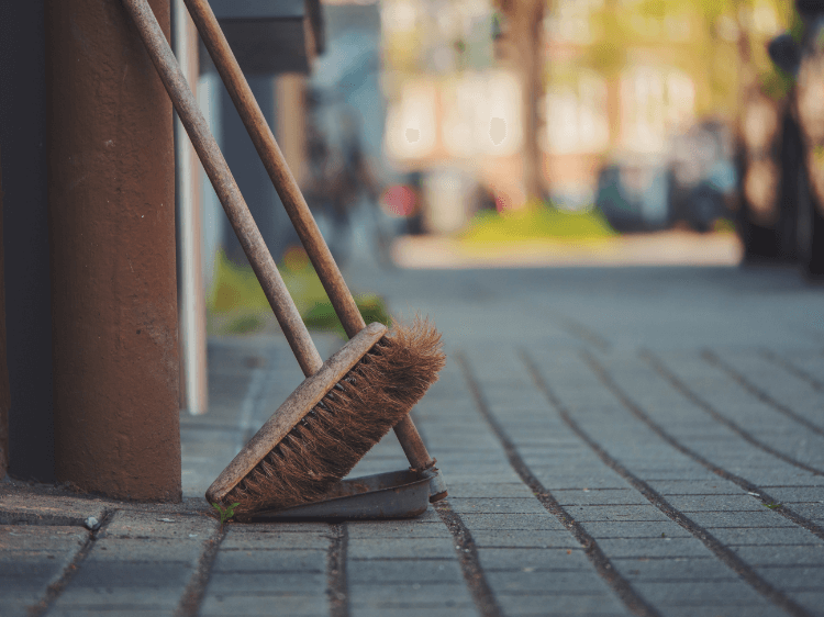 top tips for new owners: broom resting on stable door
